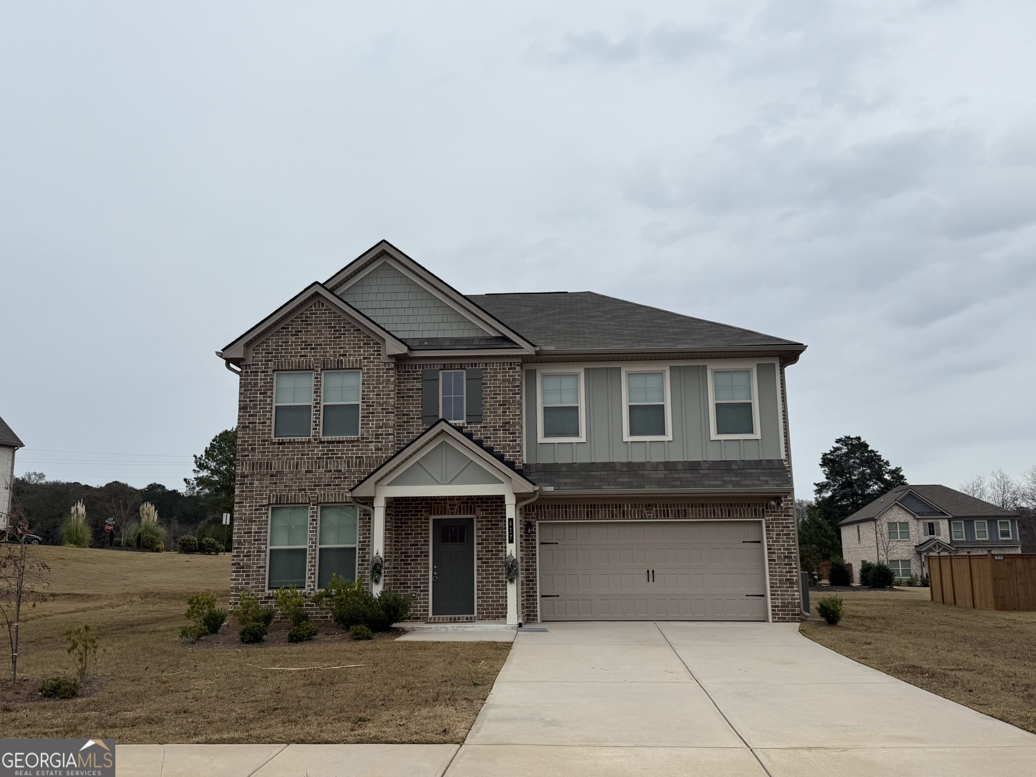 417 Sawmill Trace Hampton, GA 30228 - Photo 2 of 27 a front view of a house with a yard
