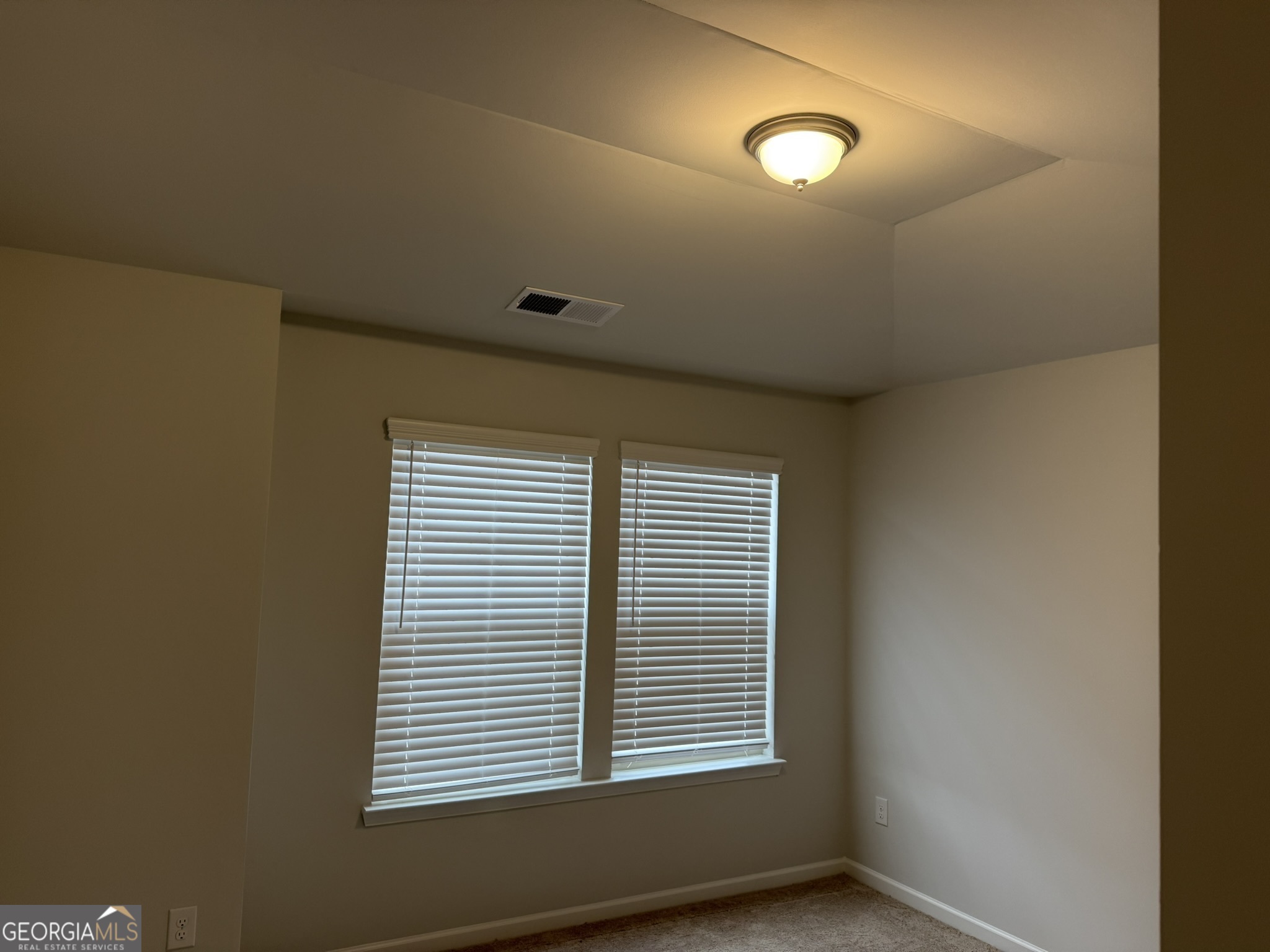 417 Sawmill Trace Hampton, GA 30228 - Photo 25 of 27 a view of an empty room with a window