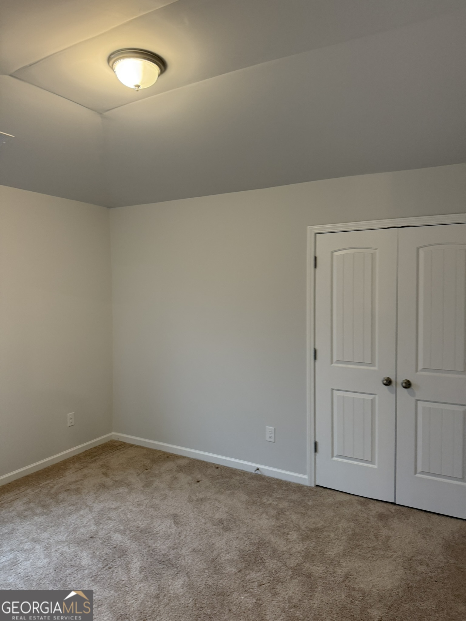 417 Sawmill Trace Hampton, GA 30228 - Photo 26 of 27 an empty room with closet area