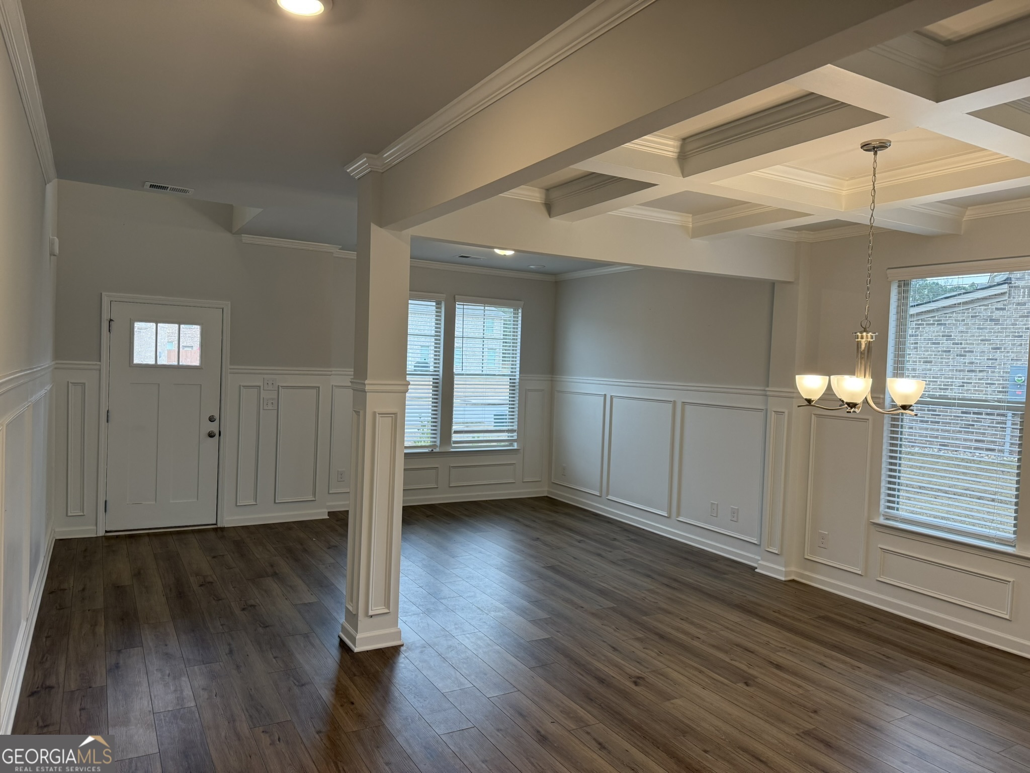 417 Sawmill Trace Hampton, GA 30228 - Photo 8 of 27 a view of an empty room with wooden floor and a window