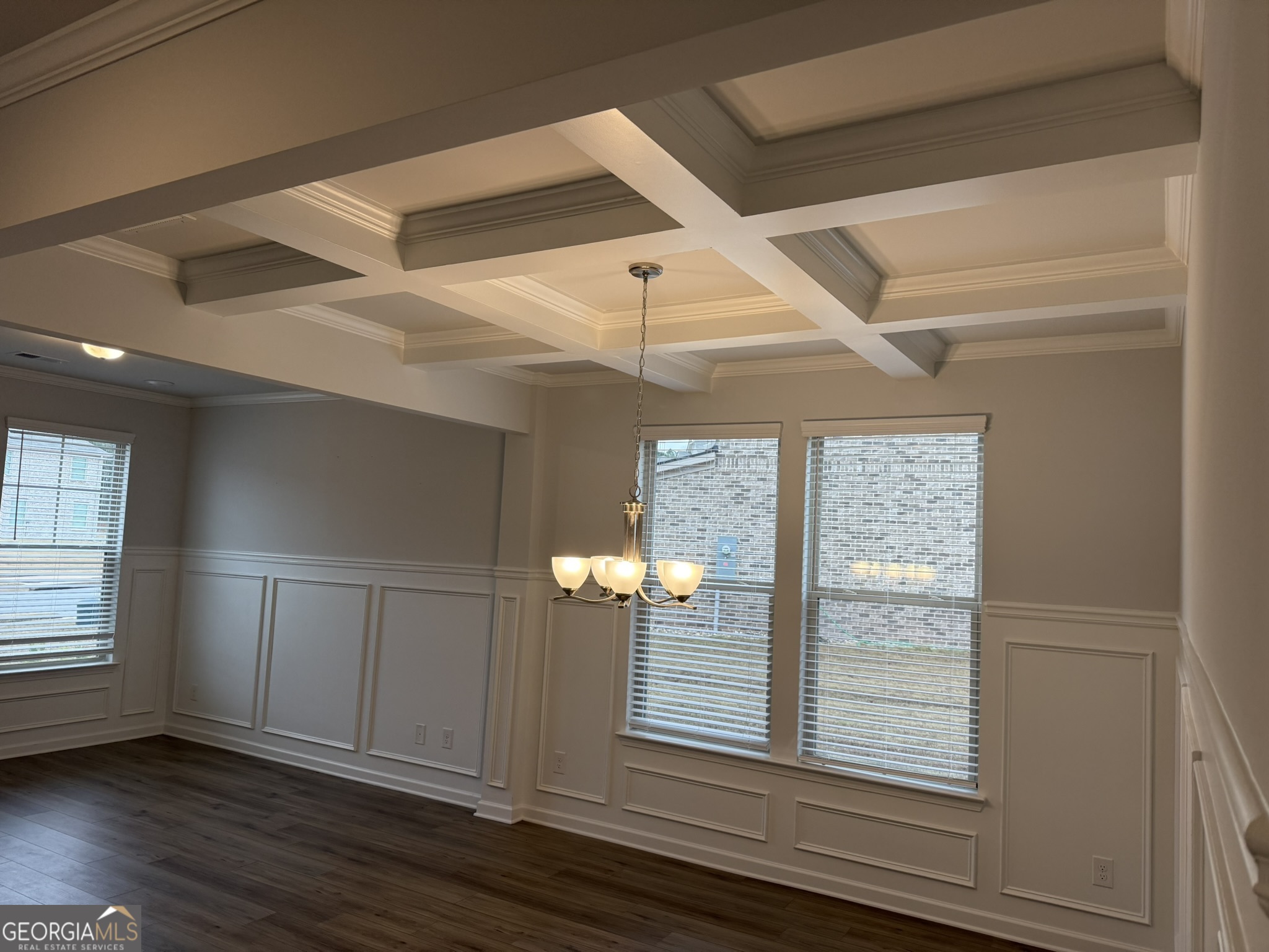 417 Sawmill Trace Hampton, GA 30228 - Photo 9 of 27 a view of empty room with wooden floor and fan