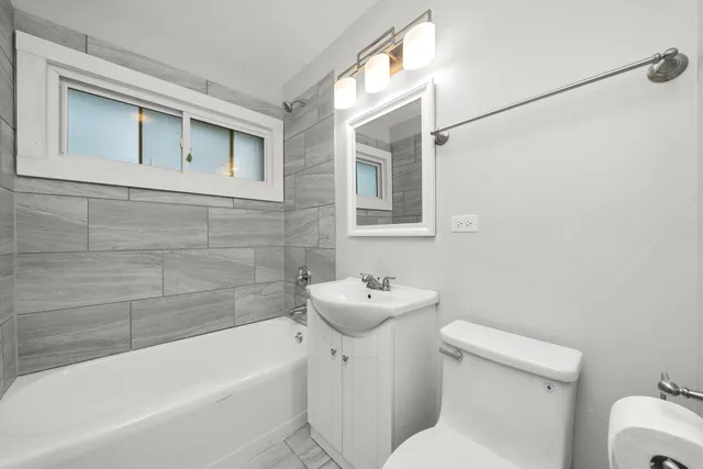 a bathroom with a sink toilet and bathtub
