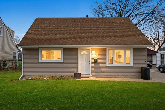 a view of house with backyard