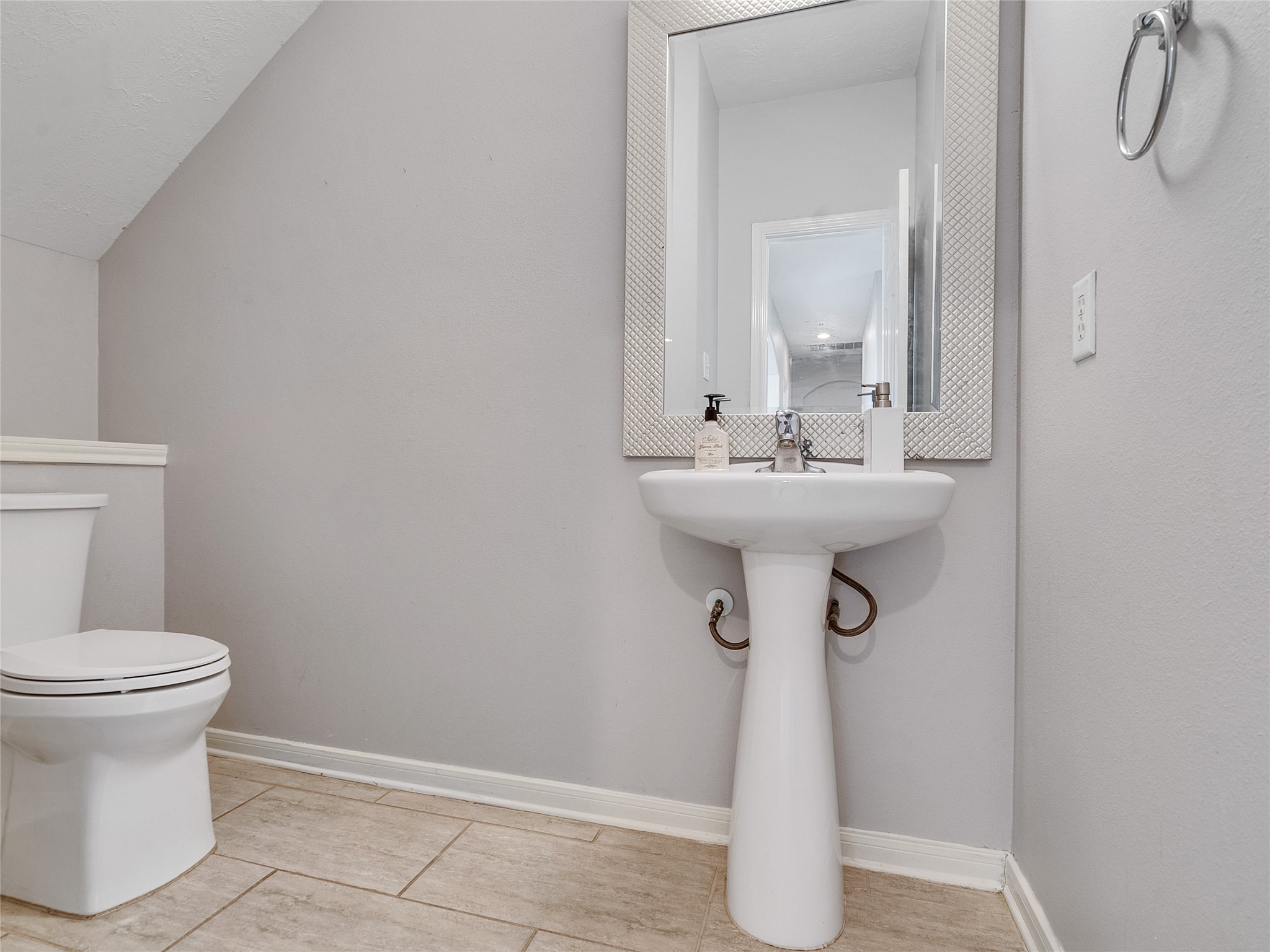 2615 Fern Lacy Drive Spring, TX 77388 - Photo 6 of 32 The half bathroom is conveniently located to accommodate any guests you may have