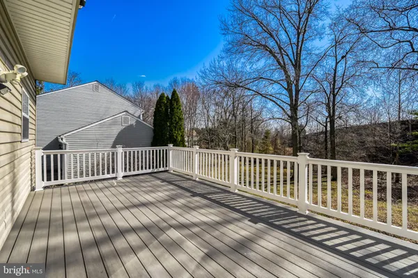 a view of a porch with wooden floor and roof