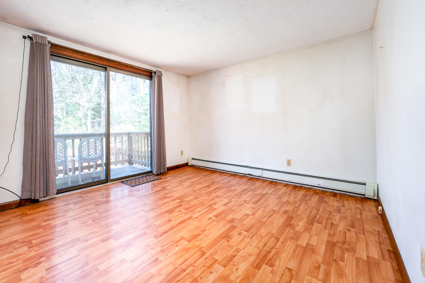 27 Howard Avenue Monument Beach, MA 02532 - Photo 11 of 24 a view of an empty room and wooden floor