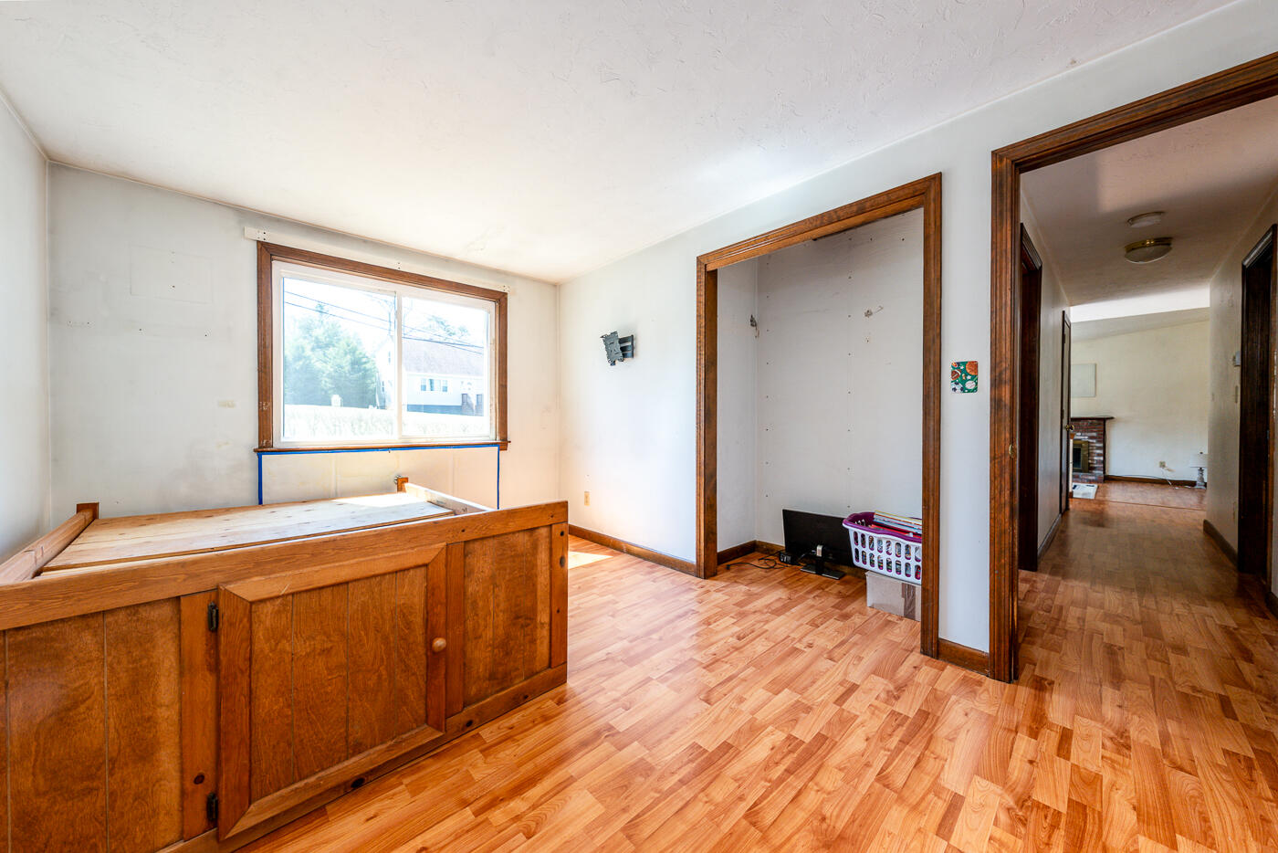 27 Howard Avenue Monument Beach, MA 02532 - Photo 15 of 24 a view of a bedroom with wooden floor and furniture