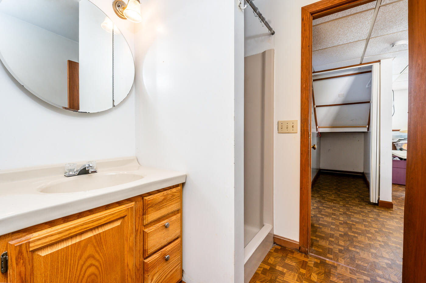 27 Howard Avenue Monument Beach, MA 02532 - Photo 21 of 24 a en suite bathroom with a granite countertop sink and a mirror