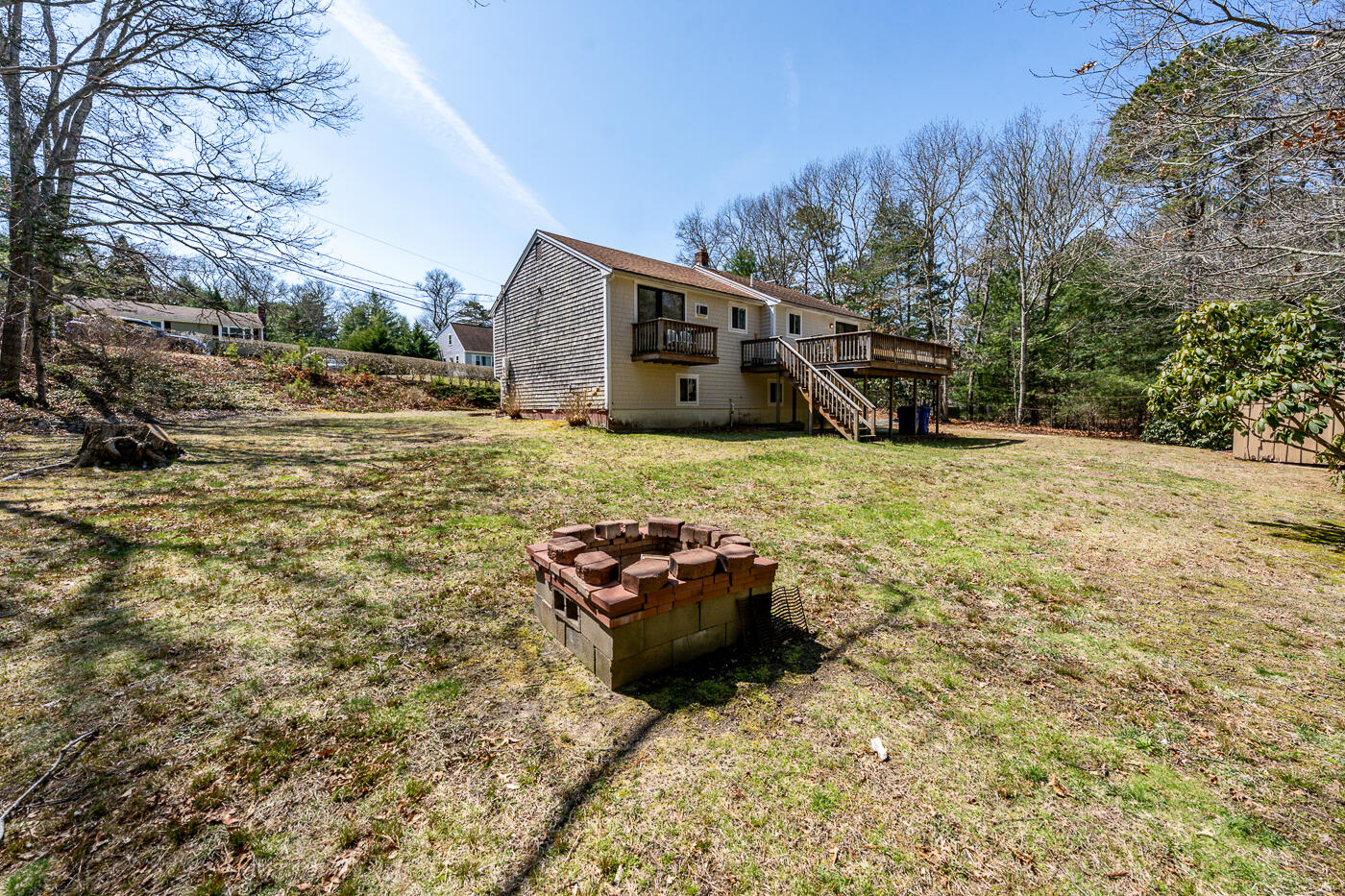 27 Howard Avenue Monument Beach, MA 02532 - Photo 24 of 24 a backyard of a house with table and chairs