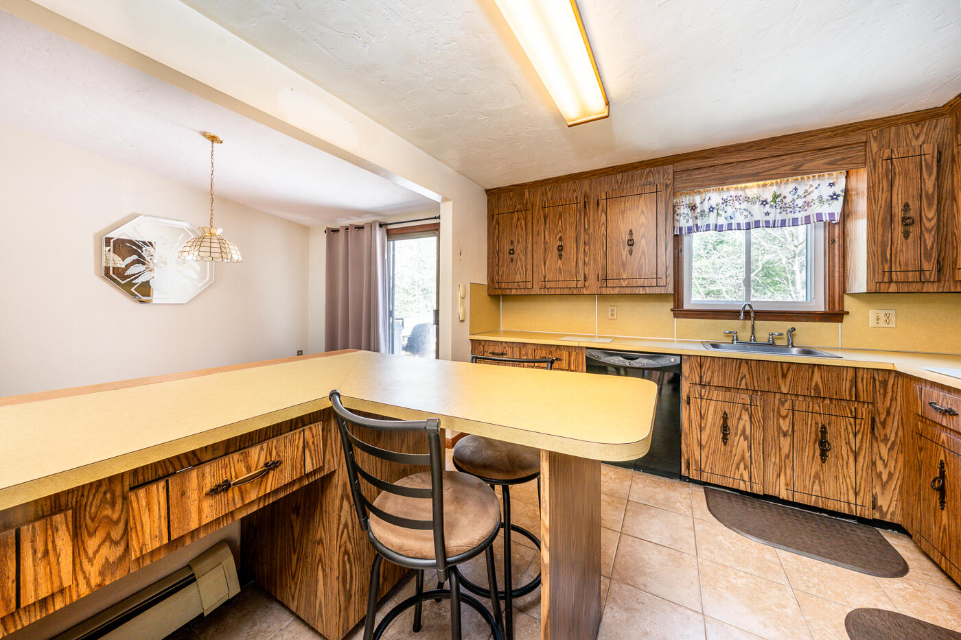 27 Howard Avenue Monument Beach, MA 02532 - Photo 6 of 24 a spacious bathroom with a granite countertop sink and a bathtub