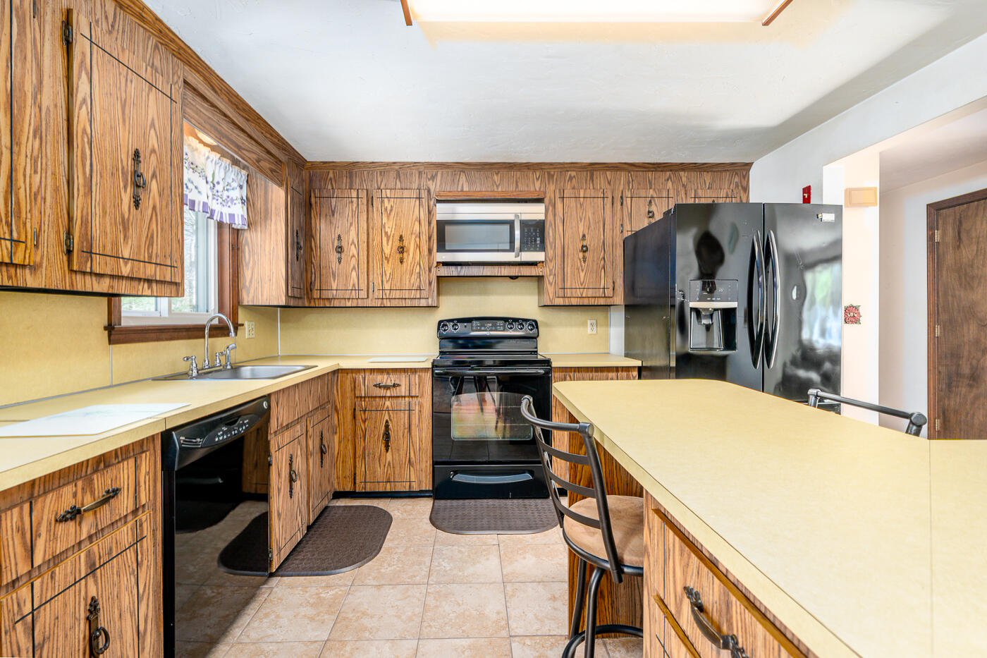 27 Howard Avenue Monument Beach, MA 02532 - Photo 7 of 24 a kitchen with stainless steel appliances granite countertop a stove and a sink