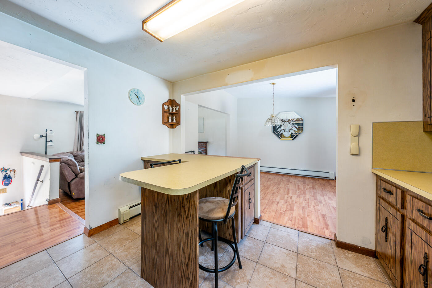 27 Howard Avenue Monument Beach, MA 02532 - Photo 8 of 24 a view of a kitchen area with furniture and stove