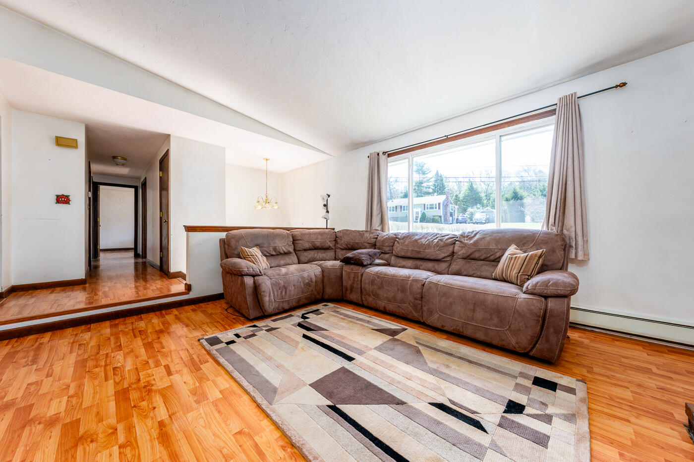 27 Howard Avenue Monument Beach, MA 02532 - Photo 9 of 24 a living room with furniture and a large window