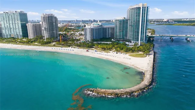a view of a lake with tall buildings
