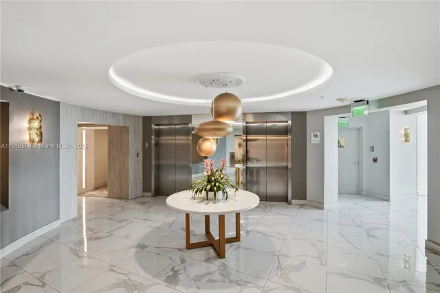 a lobby with furniture and a large window