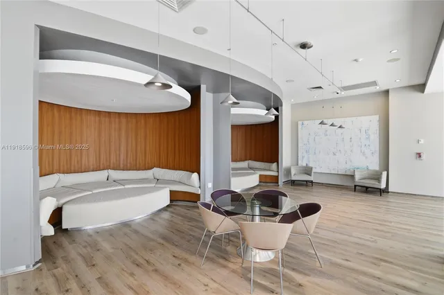 a kitchen with stainless steel appliances kitchen island granite countertop a refrigerator and a stove top oven