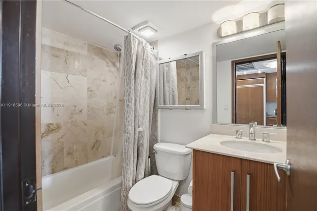 a kitchen with a sink and refrigerator