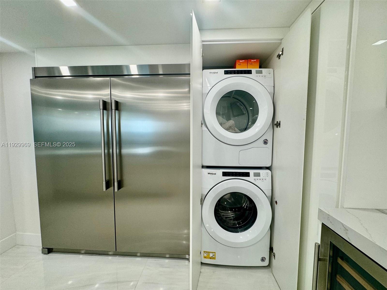 9801 Collins Avenue, Unit 5U Bal Harbour, FL 33154 - Photo 13 of 62 a utility room with dryer washer and dryer