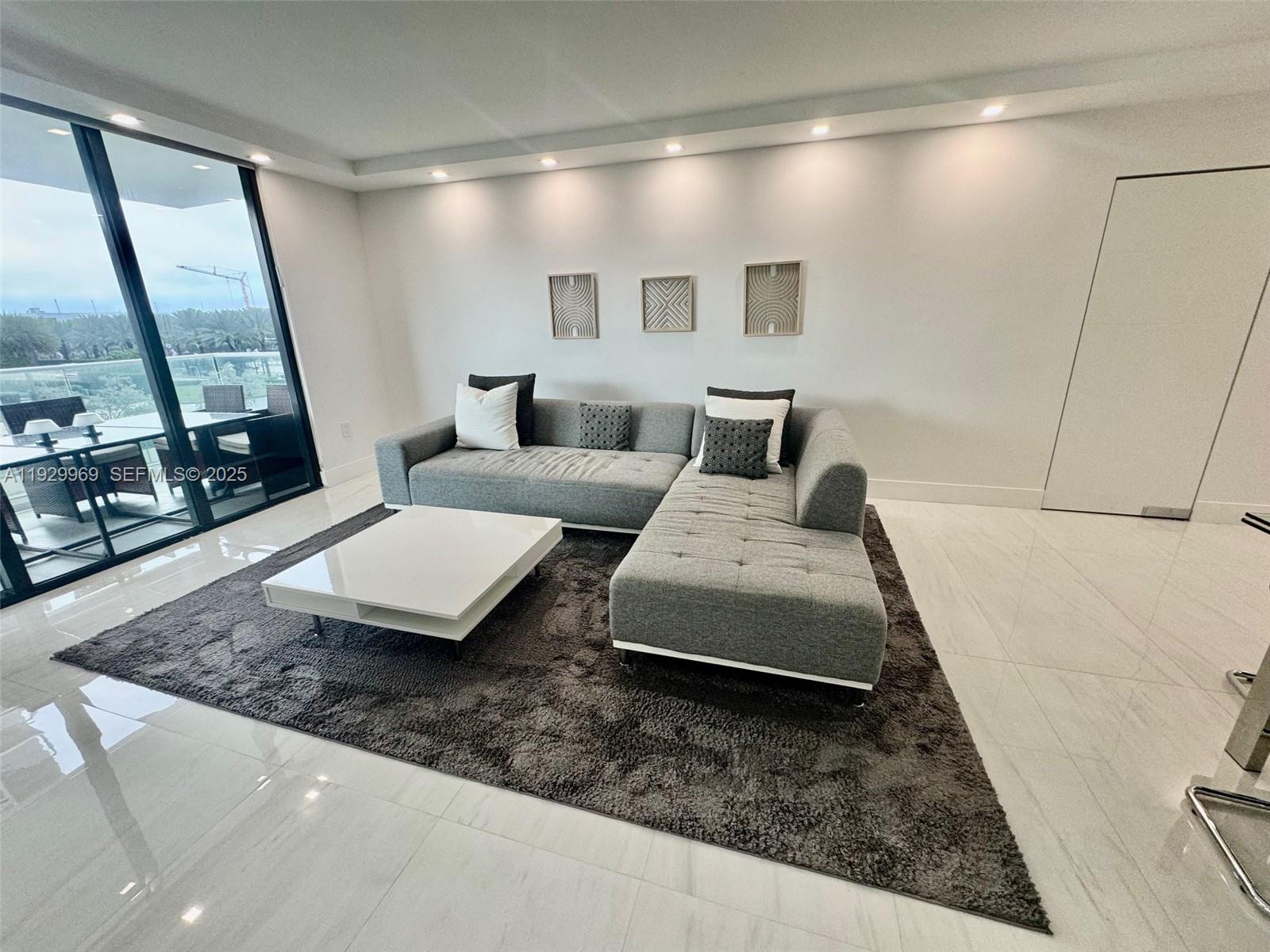 9801 Collins Avenue, Unit 5U Bal Harbour, FL 33154 - Photo 16 of 62 a living room with furniture and a rug