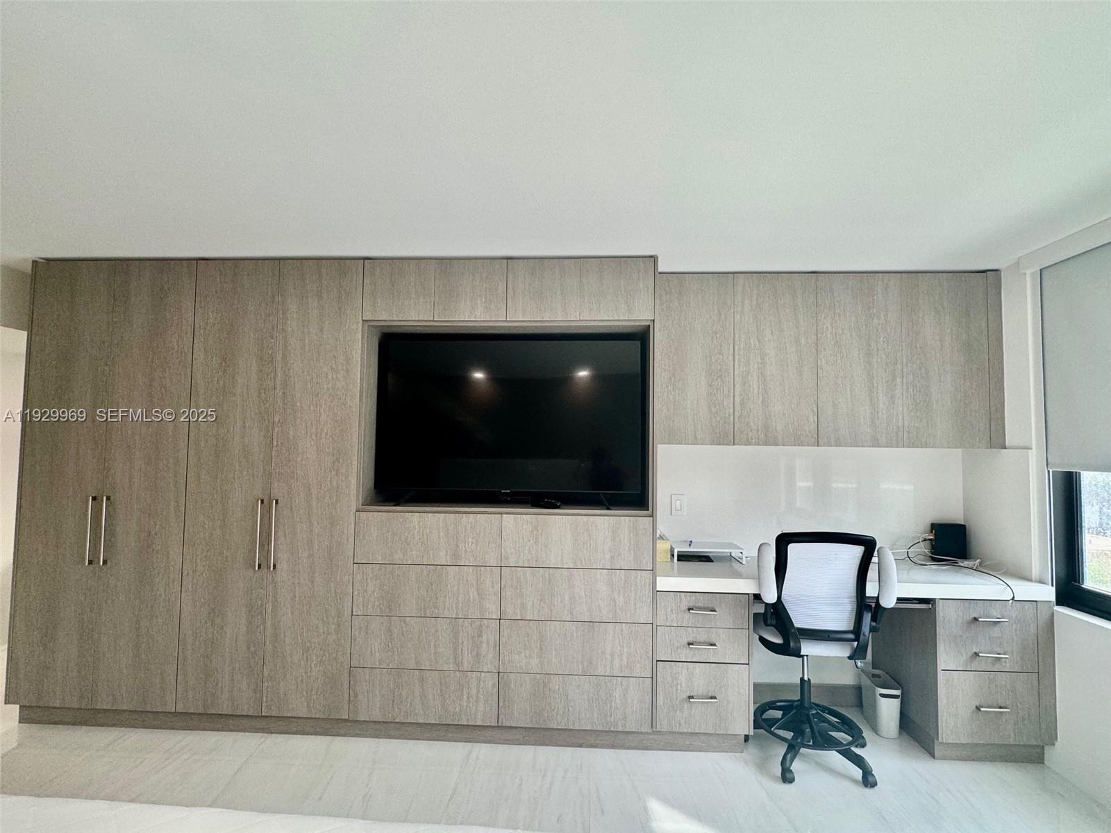 9801 Collins Avenue, Unit 5U Bal Harbour, FL 33154 - Photo 25 of 62 a bathroom with a sink a toilet and mirror