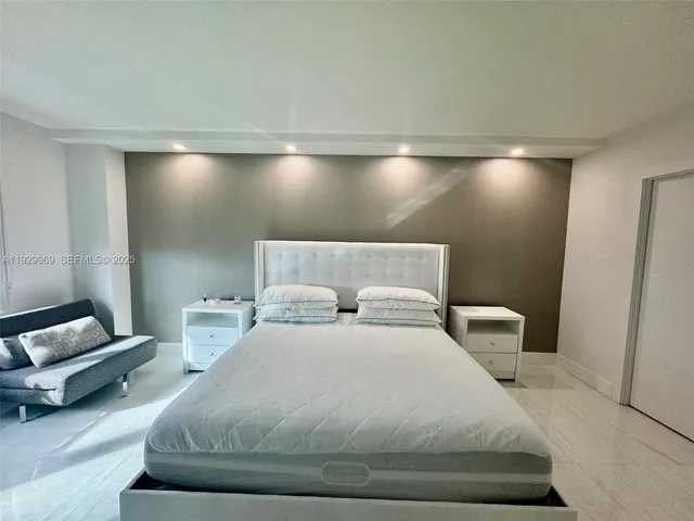 a bathroom with a shower sink and mirror