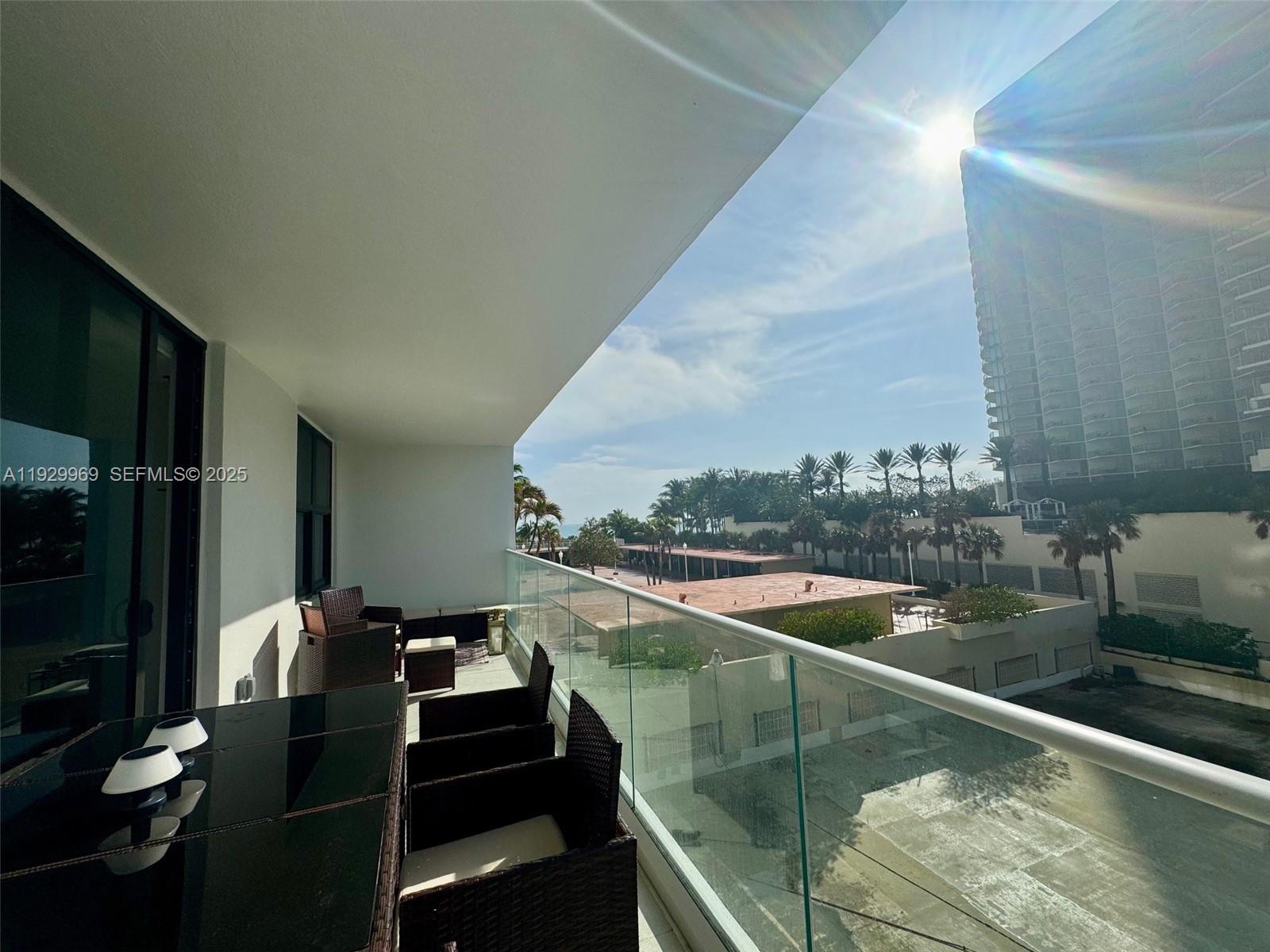 9801 Collins Avenue, Unit 5U Bal Harbour, FL 33154 - Photo 34 of 62 a view of swimming pool from a balcony