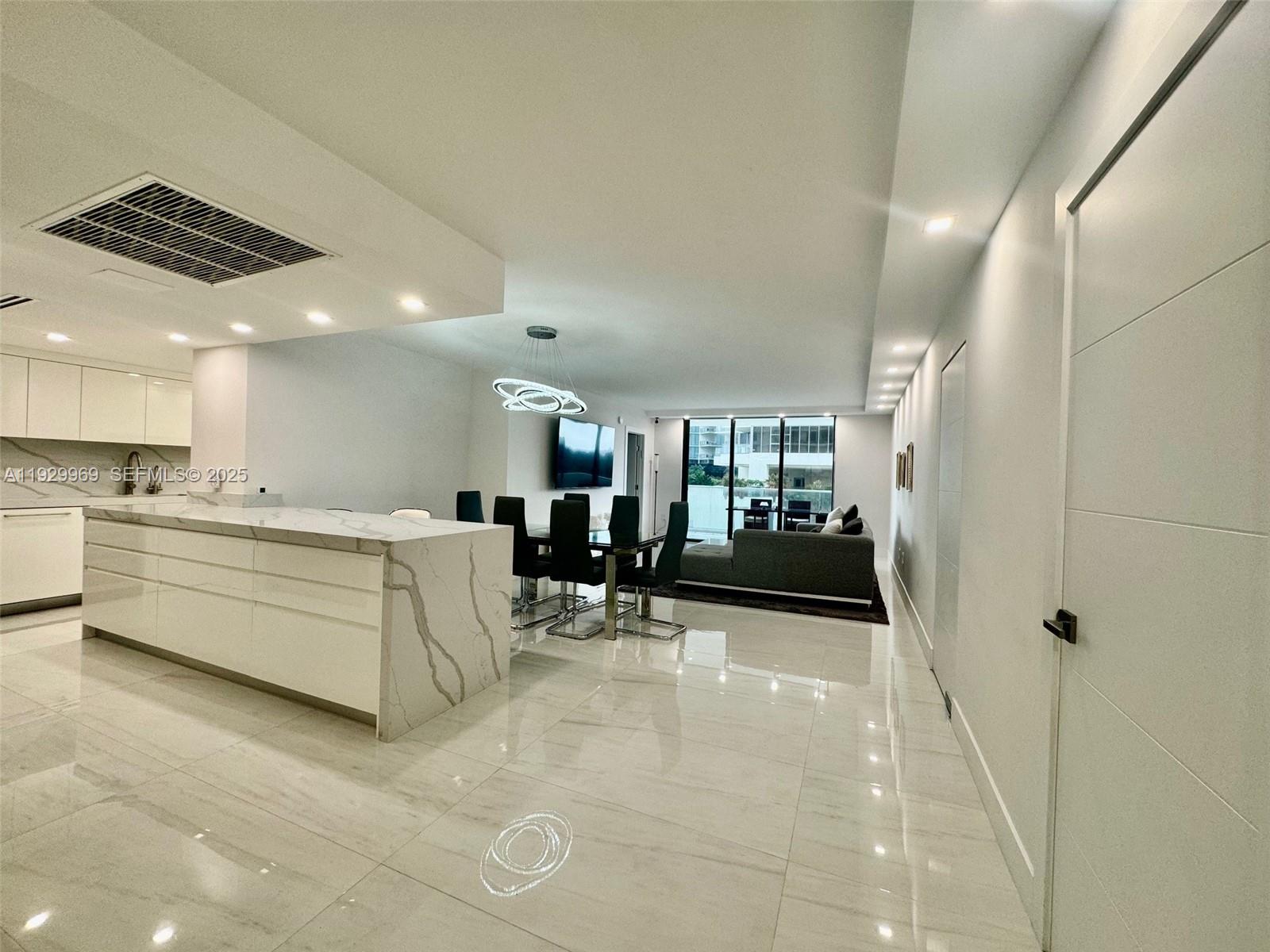 9801 Collins Avenue, Unit 5U Bal Harbour, FL 33154 - Photo 4 of 62 a view of kitchen with furniture and window