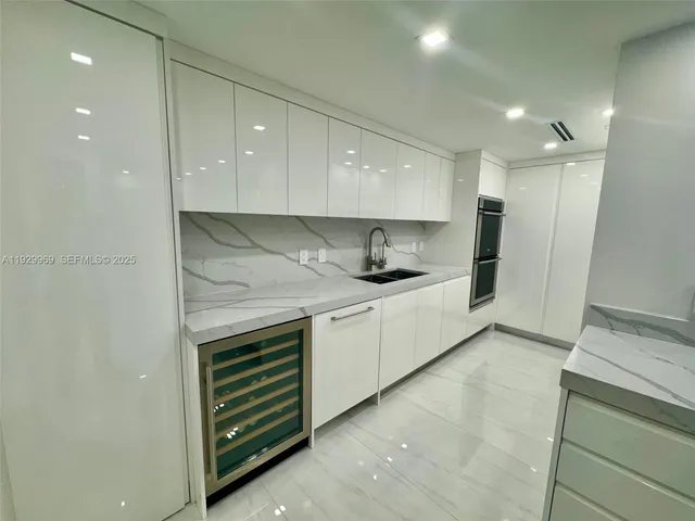 a bed room with a bed and a large mirror