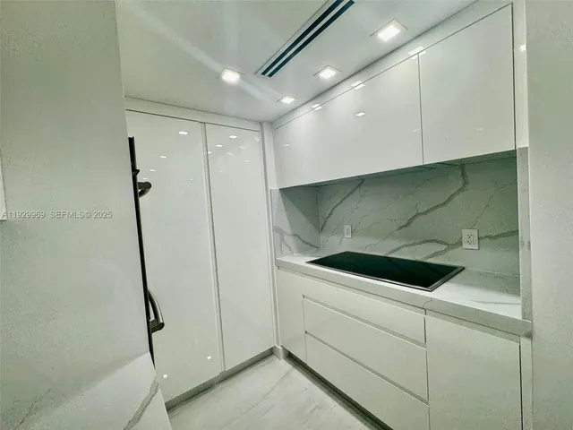 a bathroom with a shower and stove