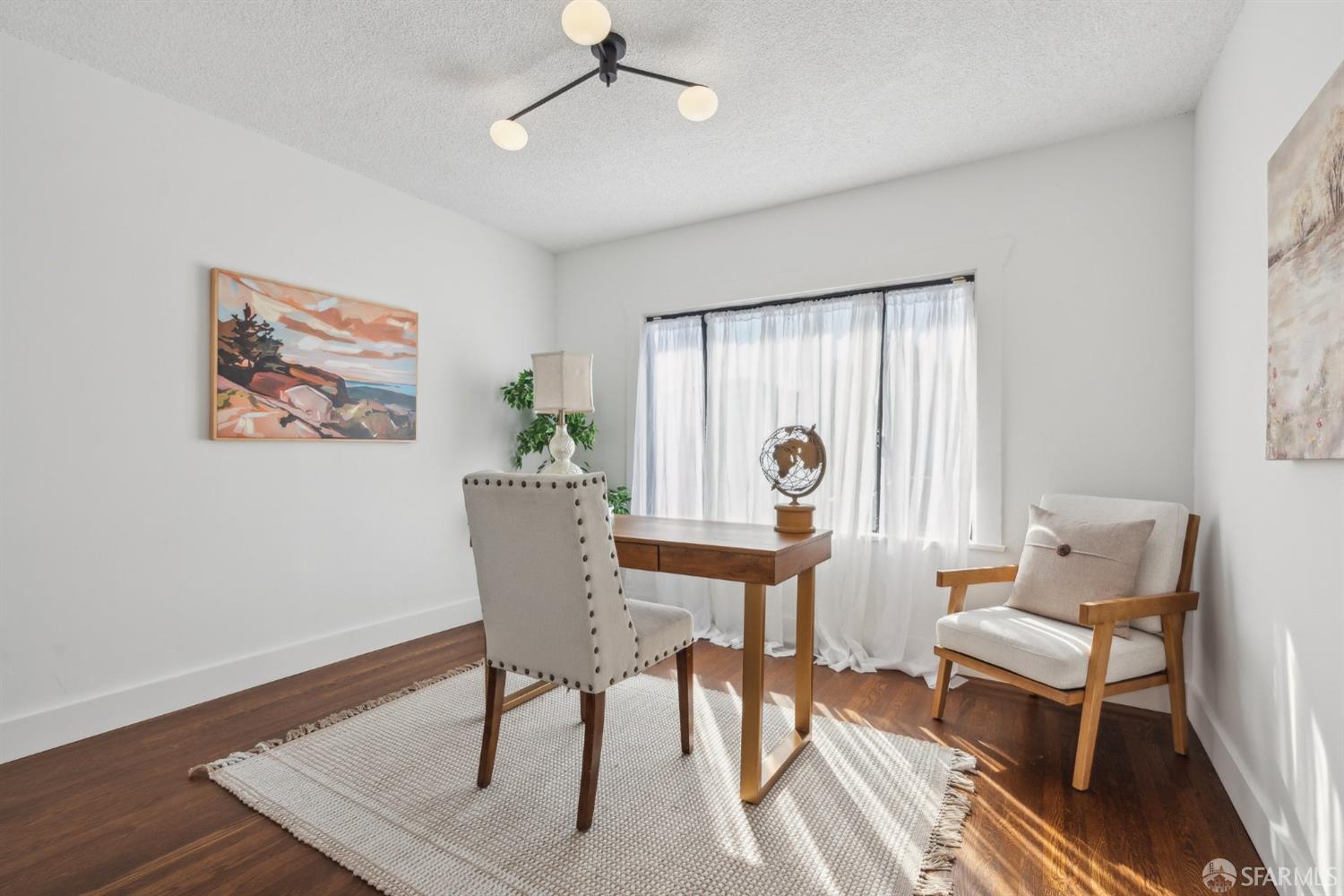 1521 Mitchell Street Oakland, CA 94601 - Photo 15 of 28 a view of a livingroom with furniture and a window
