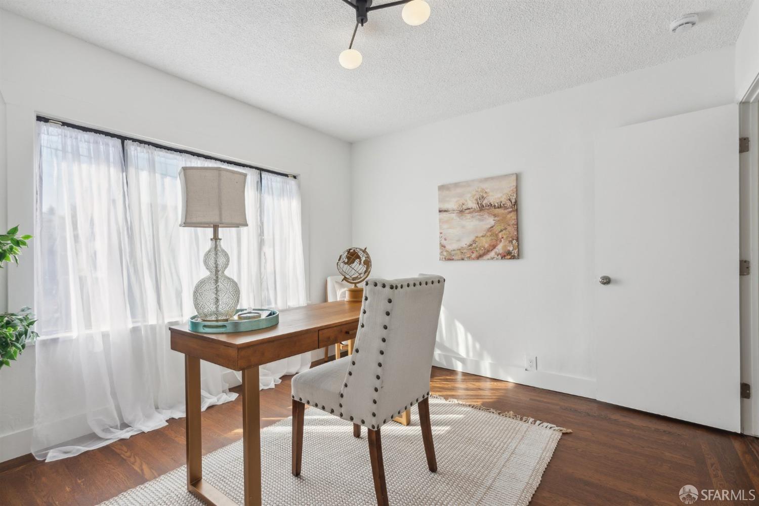 1521 Mitchell Street Oakland, CA 94601 - Photo 16 of 28 a view of a dining room with furniture and wooden floor