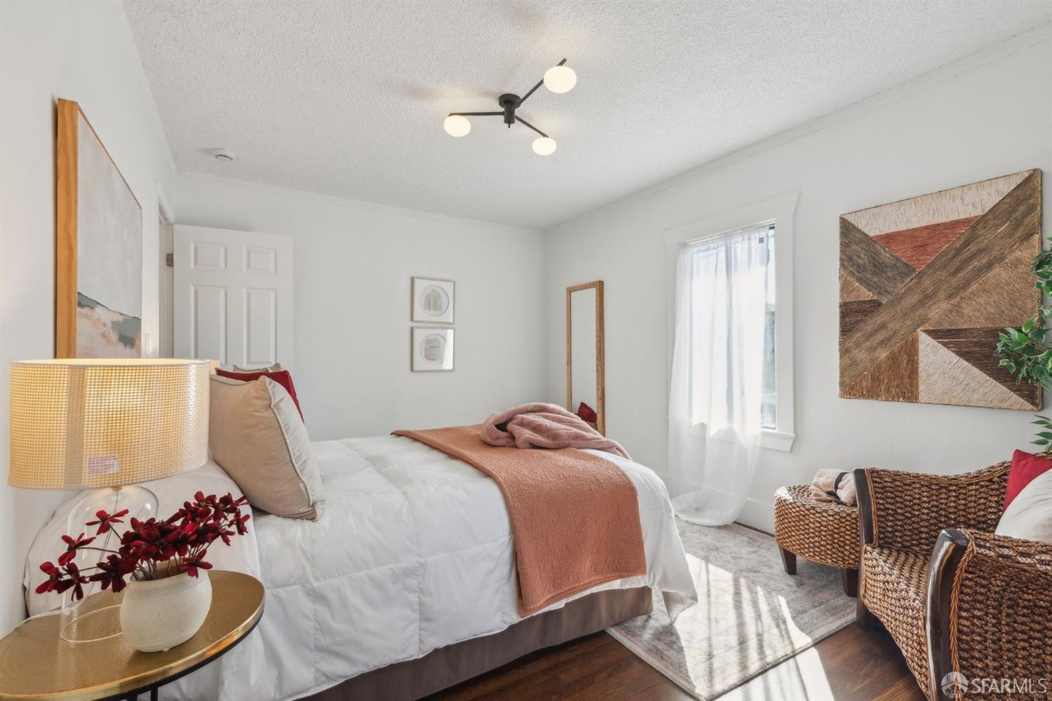 1521 Mitchell Street Oakland, CA 94601 - Photo 18 of 28 a bedroom with a bed couch and window