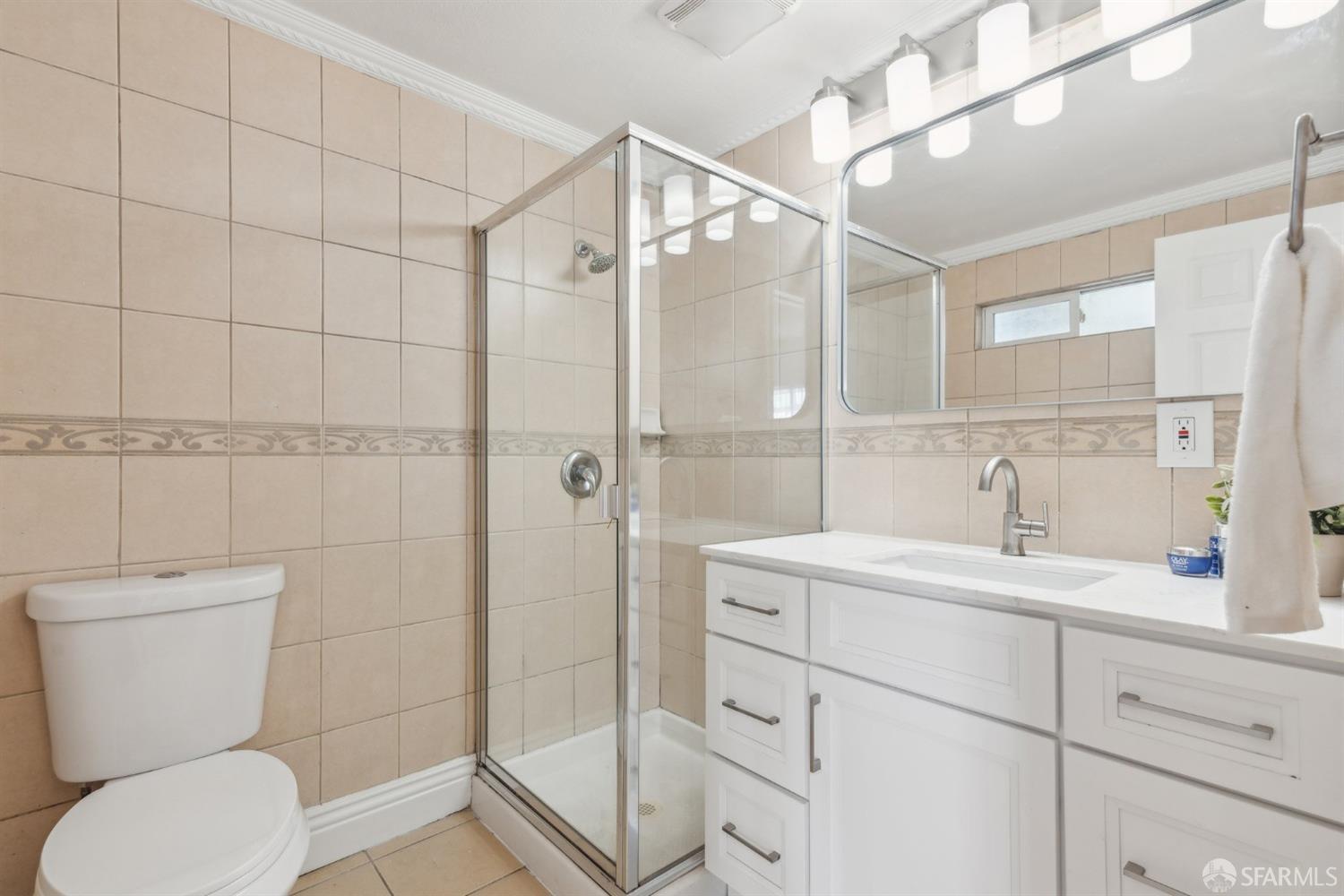 1521 Mitchell Street Oakland, CA 94601 - Photo 20 of 28 a bathroom with a toilet sink and shower