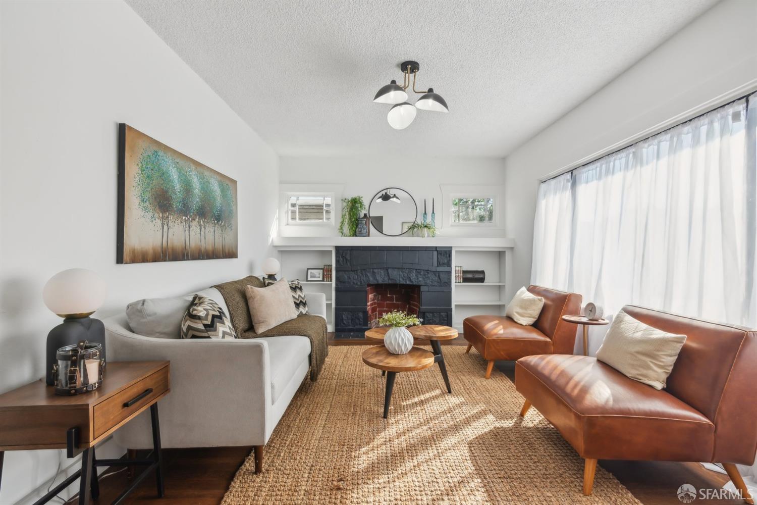 1521 Mitchell Street Oakland, CA 94601 - Photo 2 of 28 a living room with furniture and a fireplace