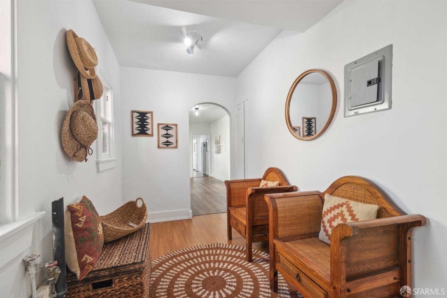 1521 Mitchell Street Oakland, CA 94601 - Photo 22 of 28 a living room with furniture a mirror and lamp