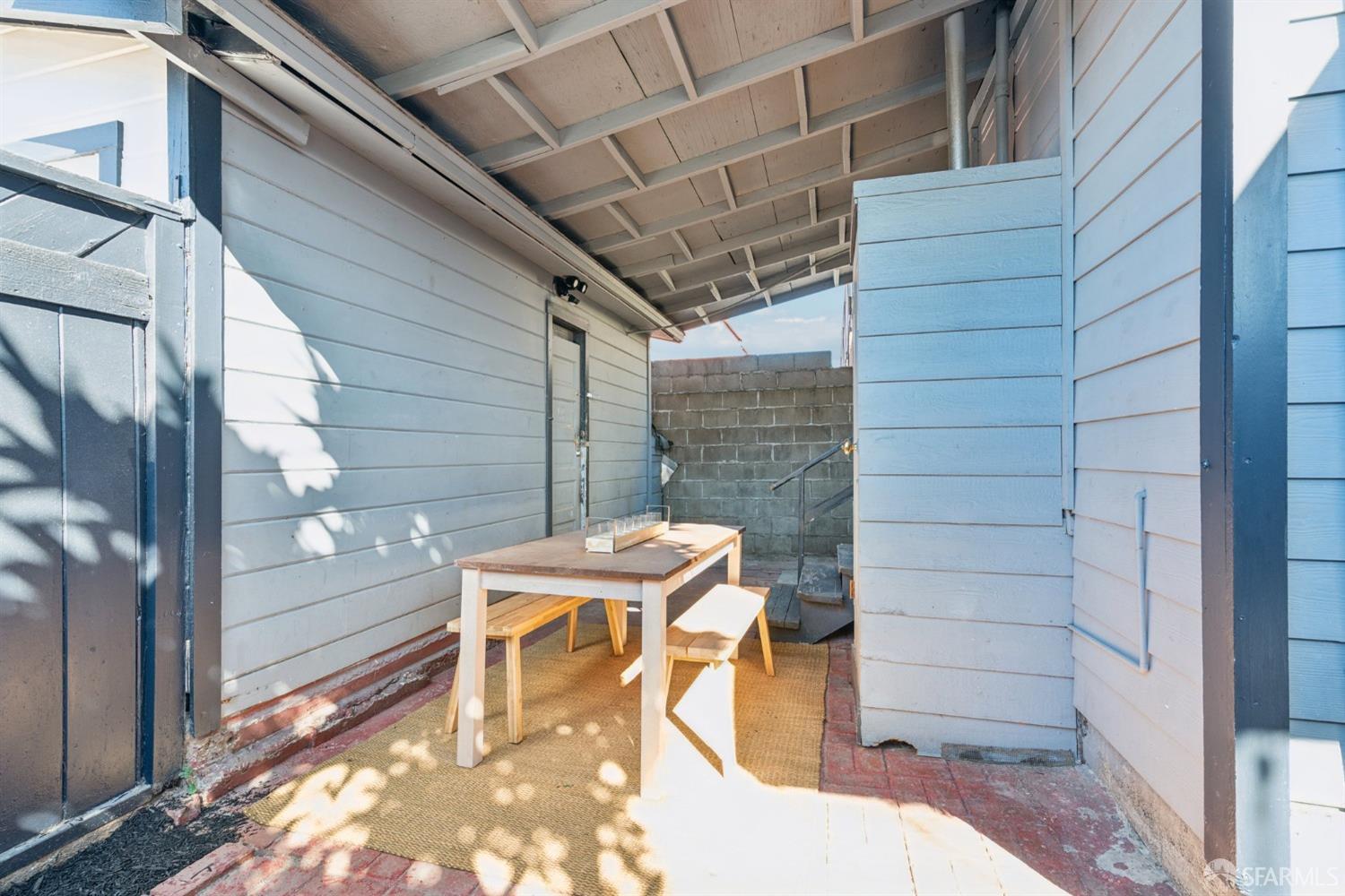 1521 Mitchell Street Oakland, CA 94601 - Photo 24 of 28 a balcony with table and chairs