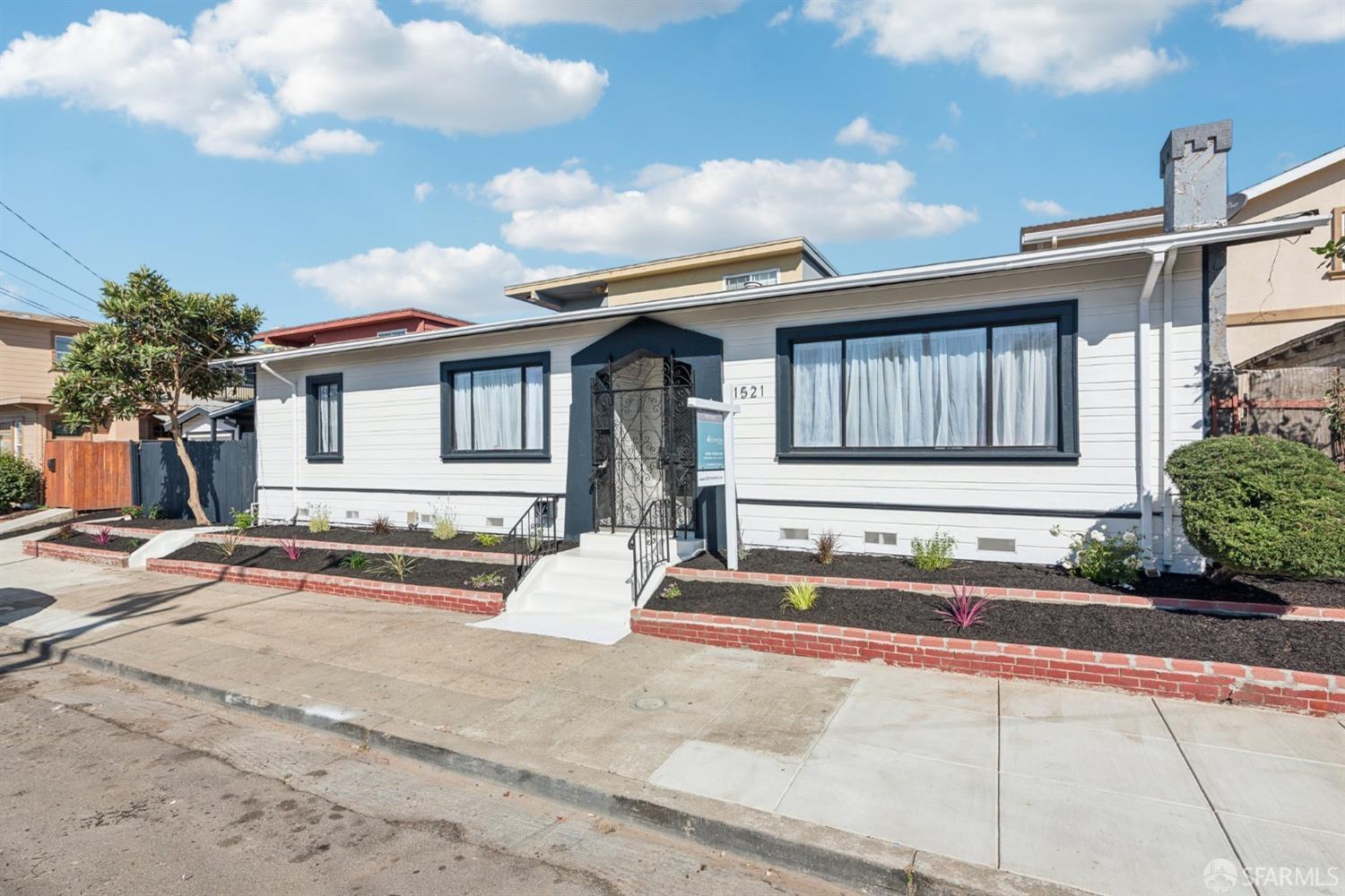 1521 Mitchell Street Oakland, CA 94601 - Photo 28 of 28 a front view of a house with a garden and pathway
