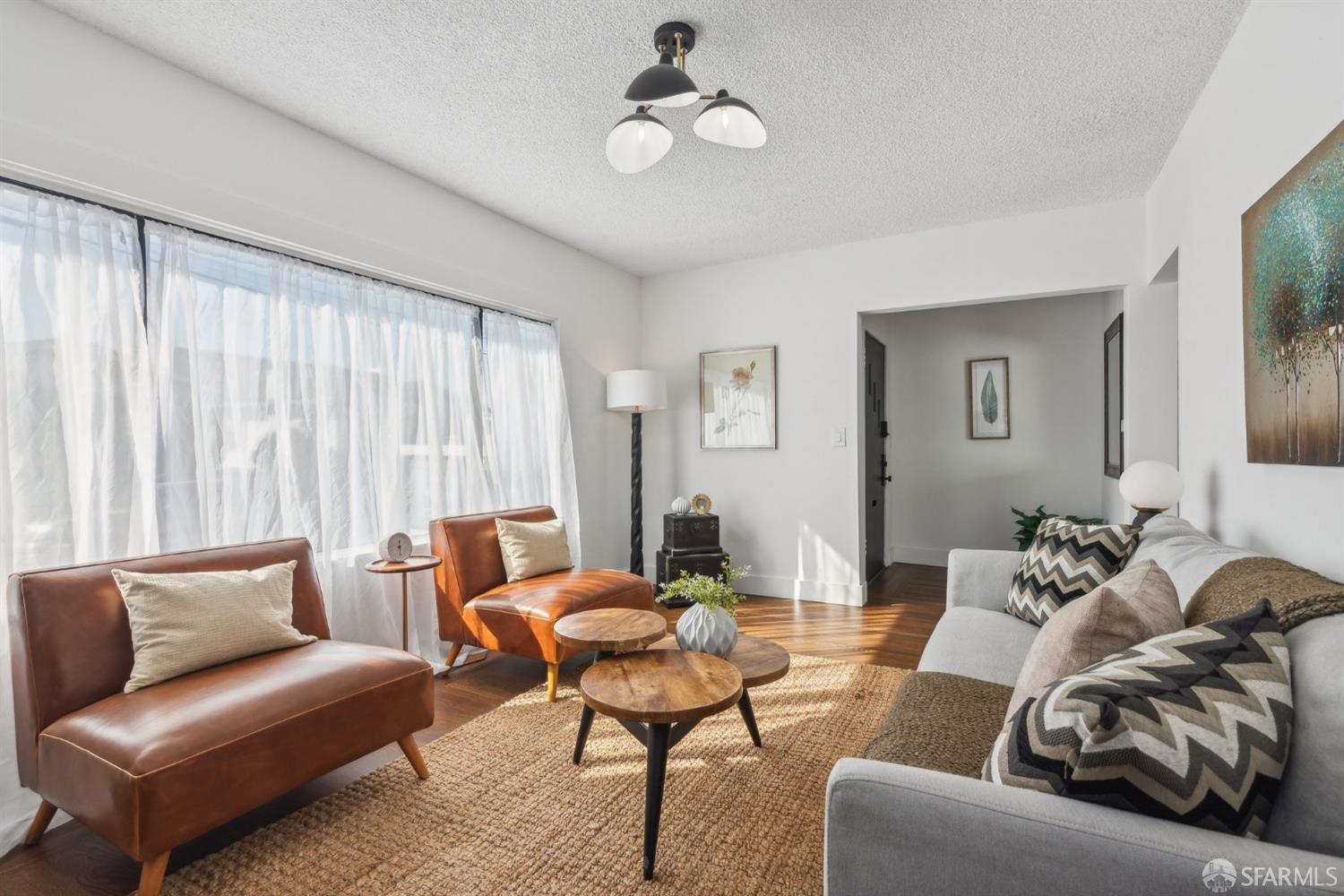 1521 Mitchell Street Oakland, CA 94601 - Photo 5 of 28 a living room with furniture and a large window
