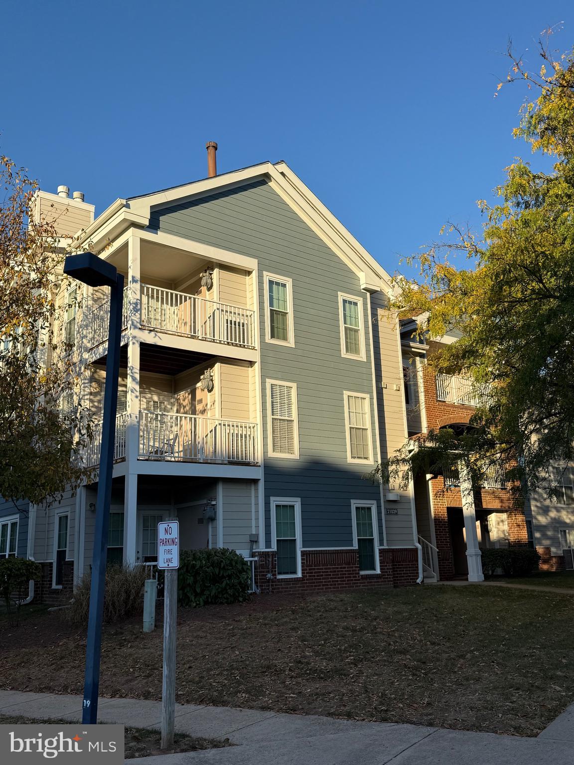 21029 Timber Ridge Terrace, Unit 302 Ashburn, VA 20147 - Photo 2 of 14 a front view of a house