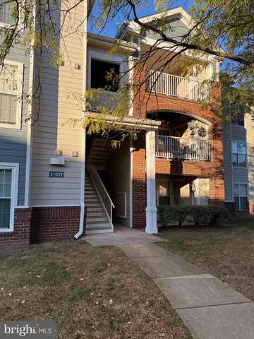 a view of a house with a street