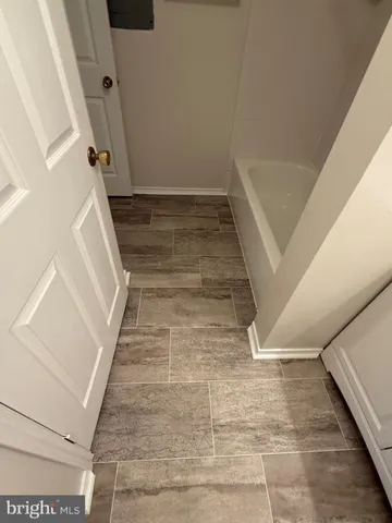 a view of staircase with white walls and windows