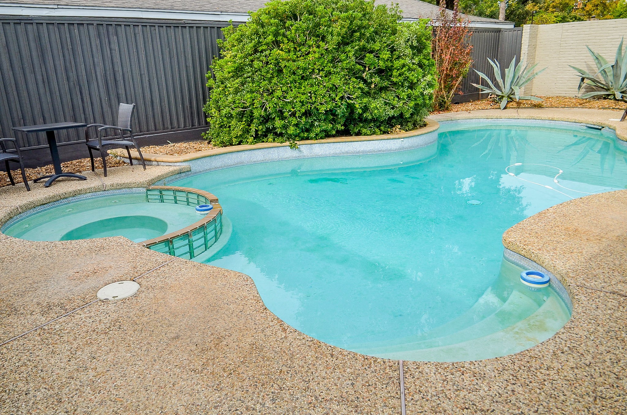 10003 Burgoyne Road Houston, TX 77042 - Photo 11 of 48 a view of a swimming pool with a yard