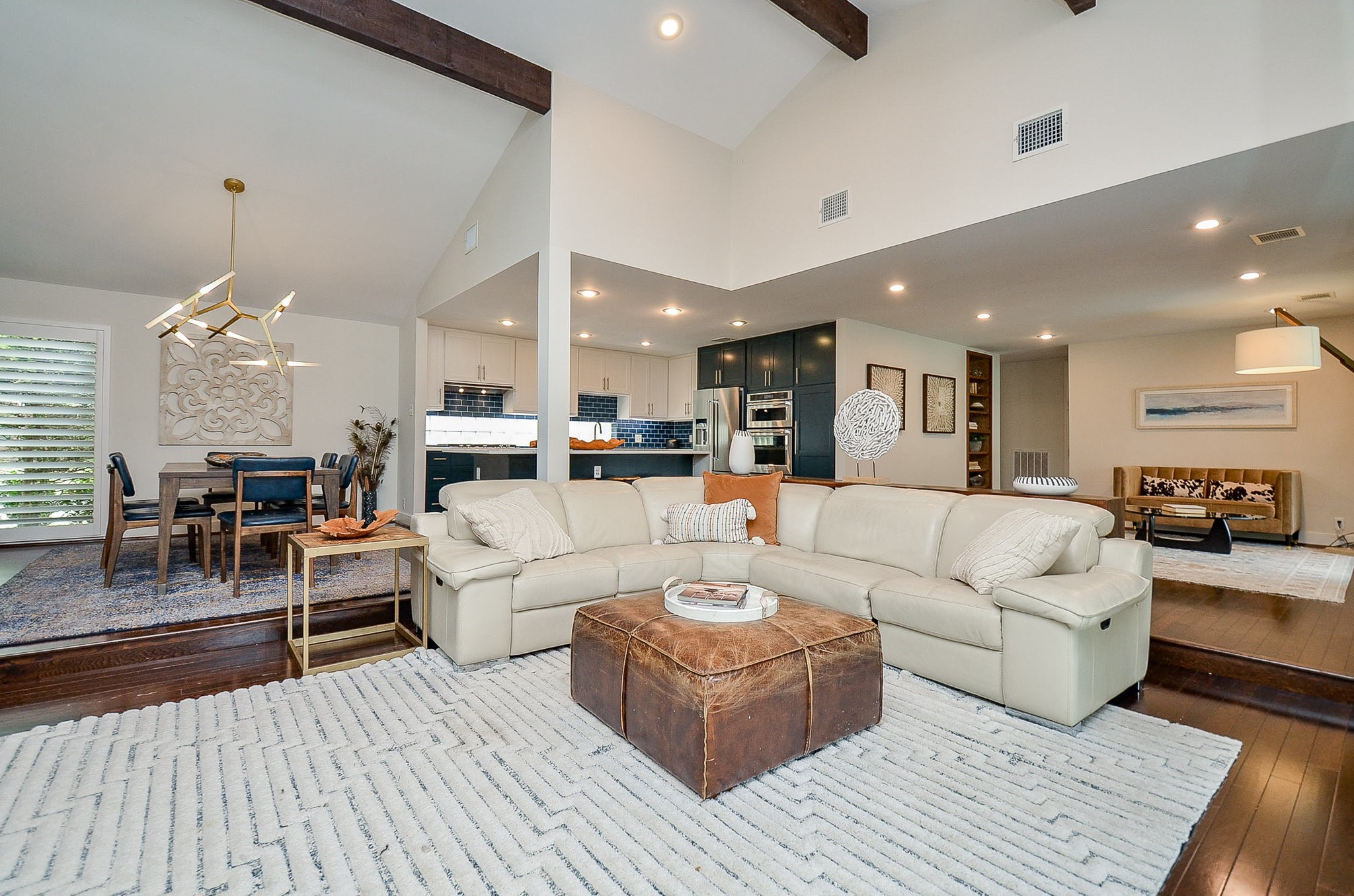 10003 Burgoyne Road Houston, TX 77042 - Photo 12 of 48 a living room with furniture and a view of kitchen