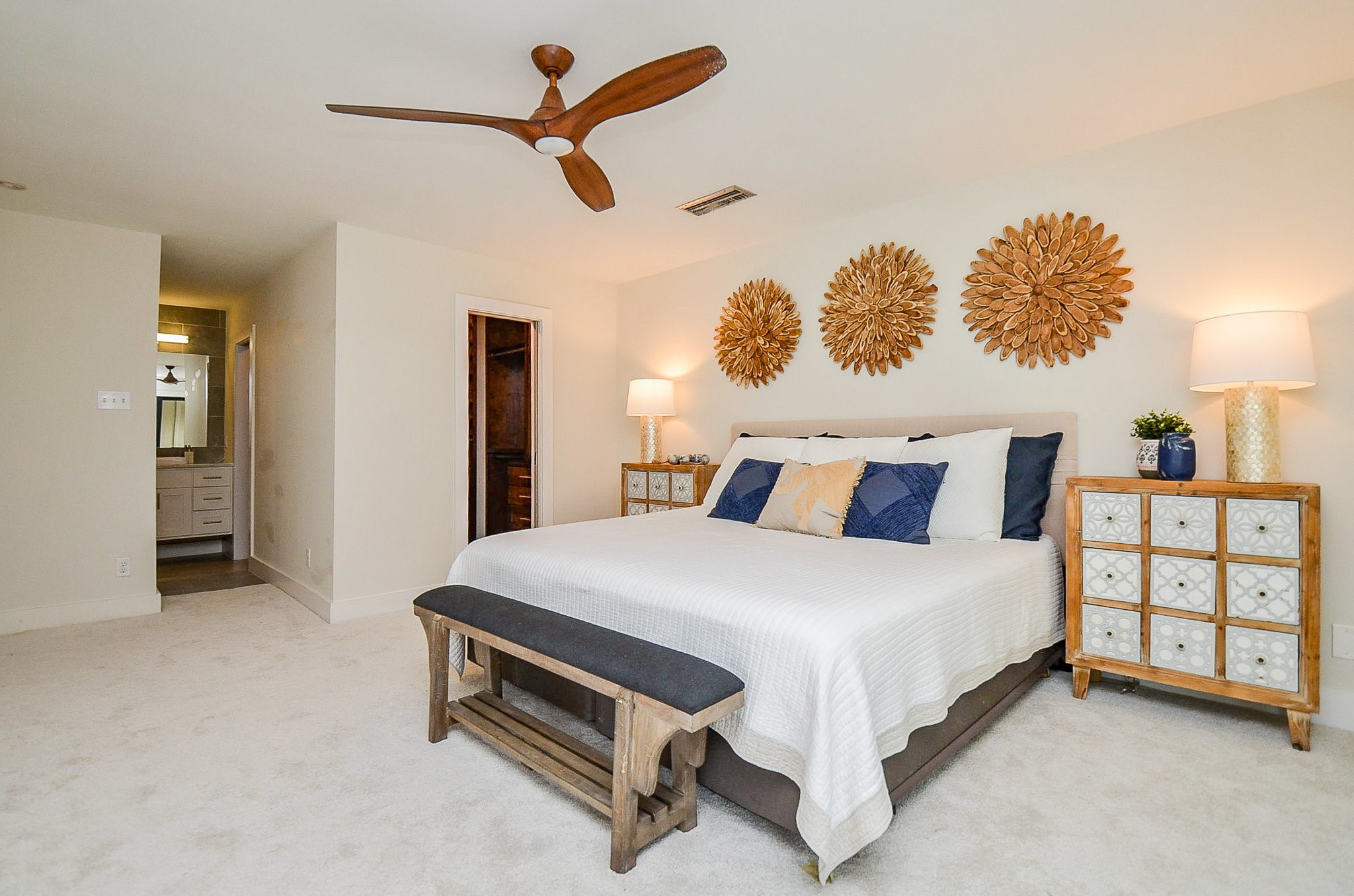 10003 Burgoyne Road Houston, TX 77042 - Photo 20 of 48 a spacious bedroom with a bed and a chandelier