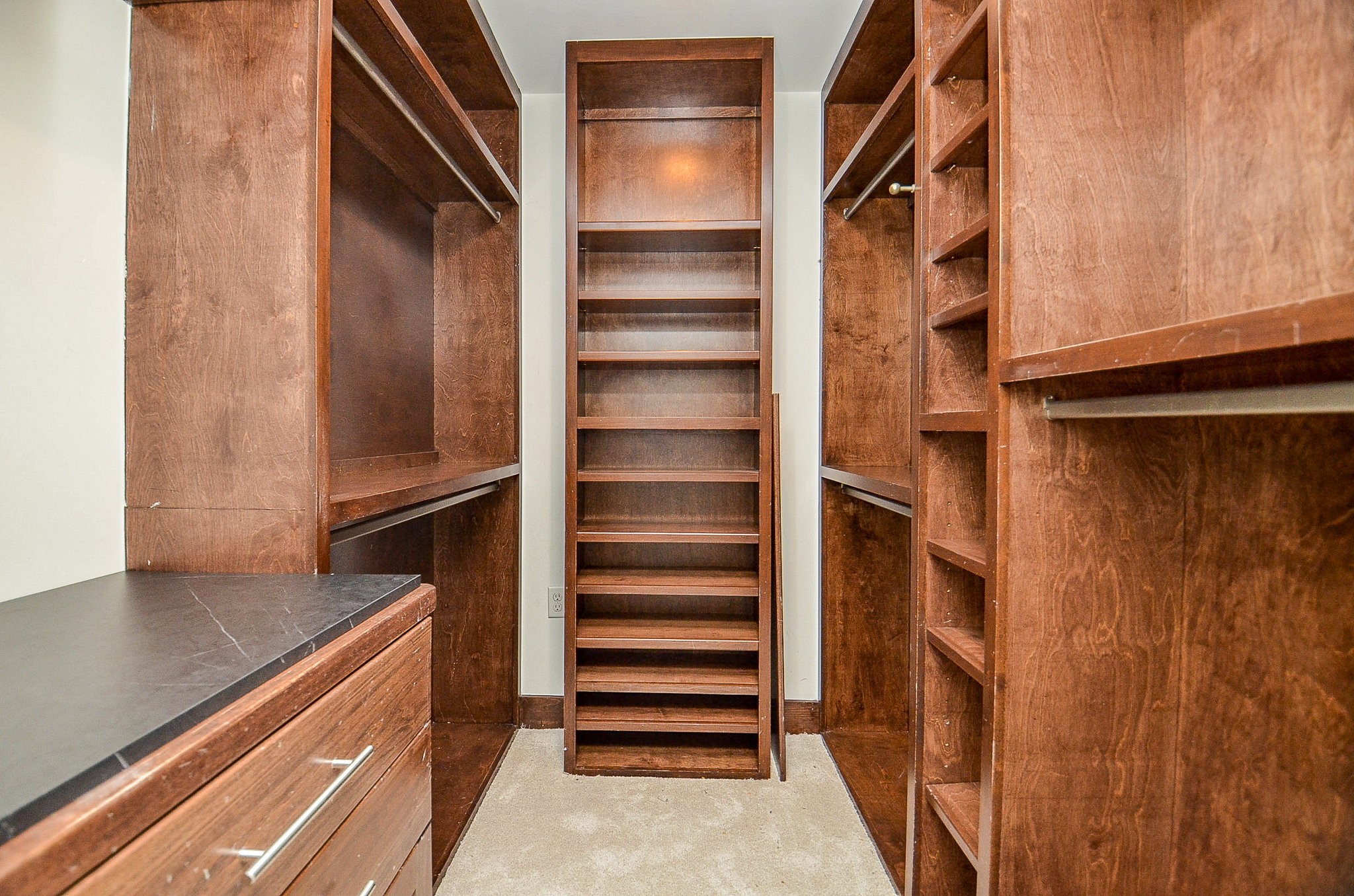 10003 Burgoyne Road Houston, TX 77042 - Photo 22 of 48 a view of walk in closet with empty racks