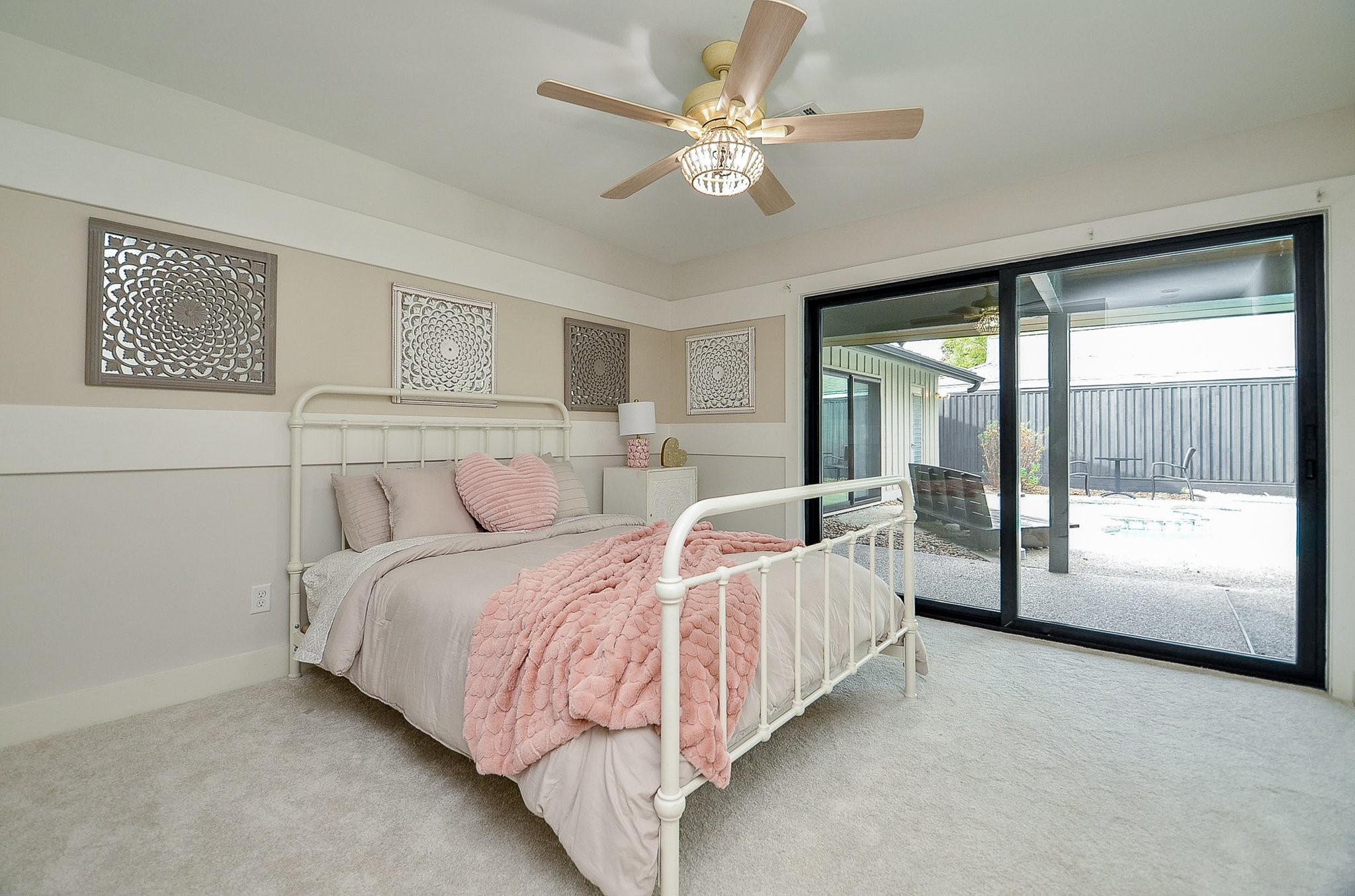 10003 Burgoyne Road Houston, TX 77042 - Photo 27 of 48 a bed sitting in a spacious bedroom next to a window