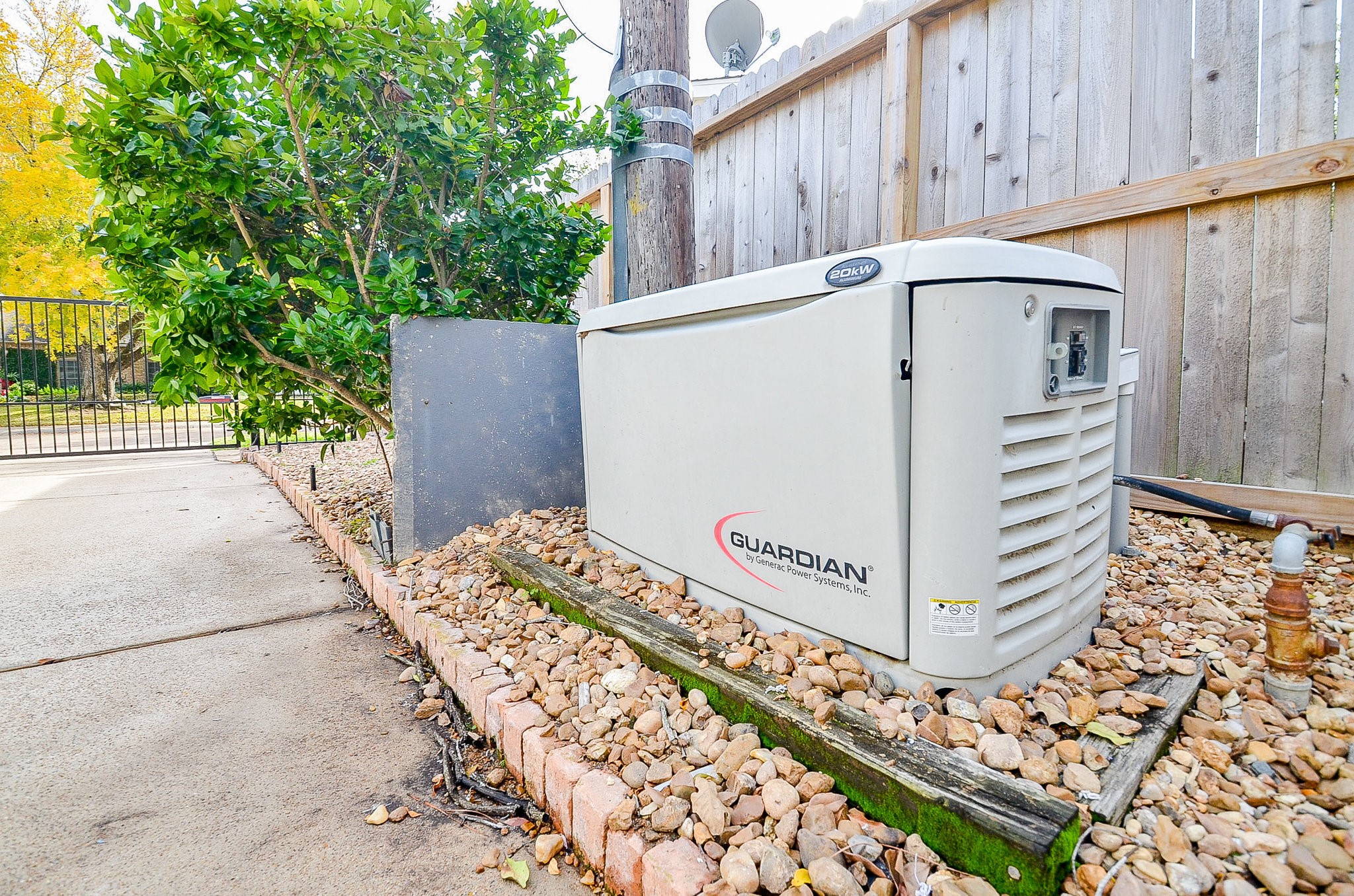 10003 Burgoyne Road Houston, TX 77042 - Photo 39 of 48 a view of a entrance gate of the house and wooden deck