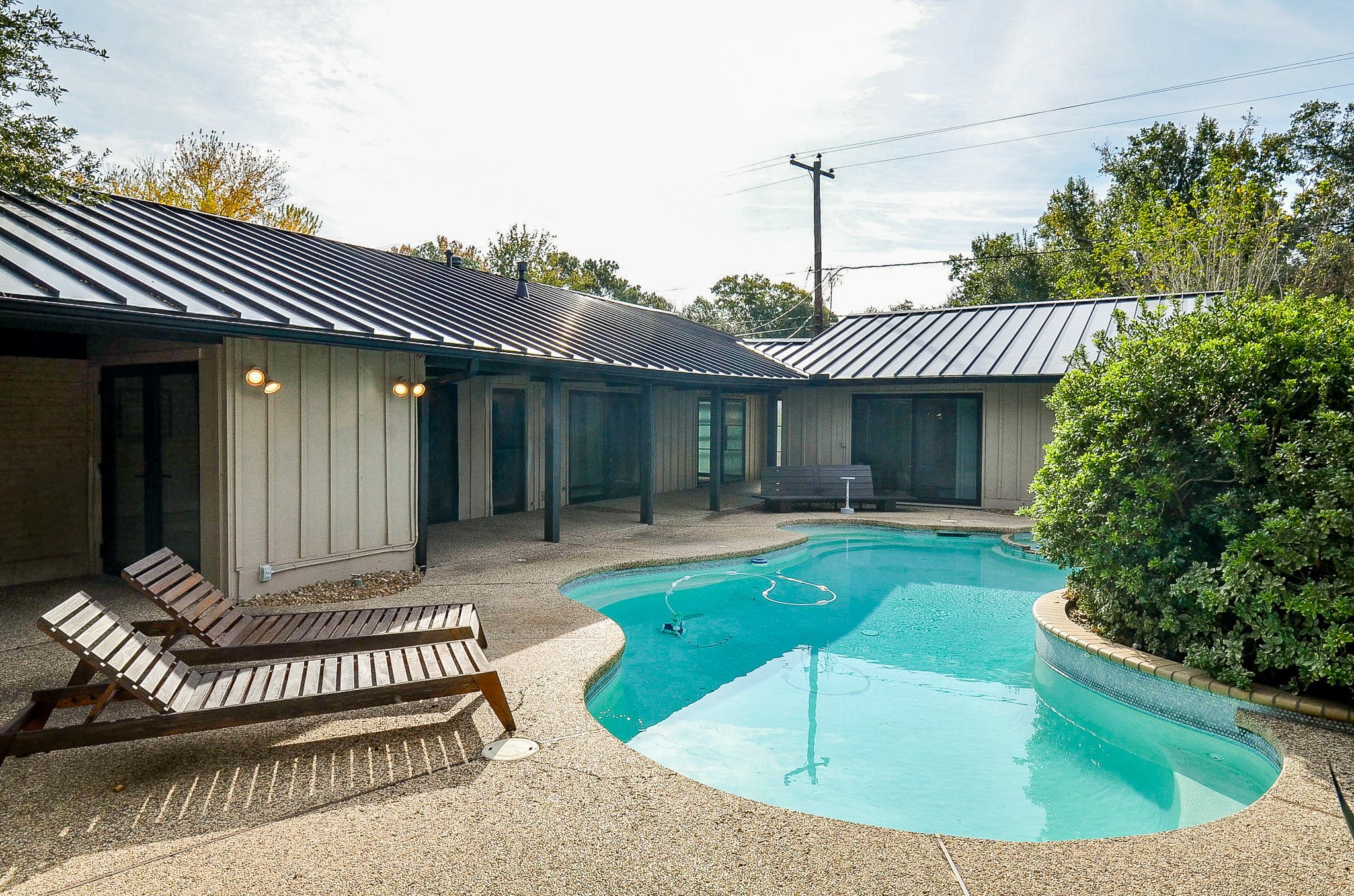 10003 Burgoyne Road Houston, TX 77042 - Photo 8 of 48 a view of a house with a small pool and a yard