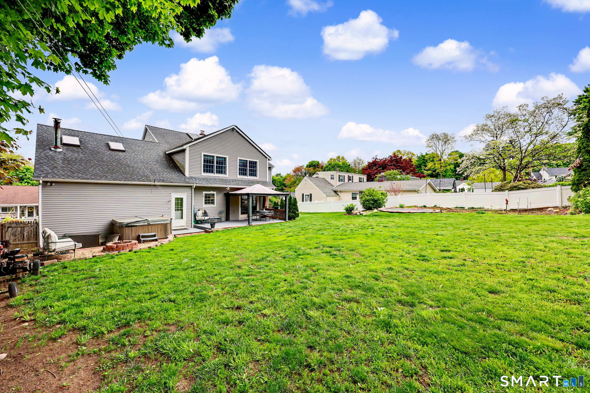 7 Merrill Road Trumbull, CT 06611 - Photo 37 of 40 a view of a house with a big yard and potted plants