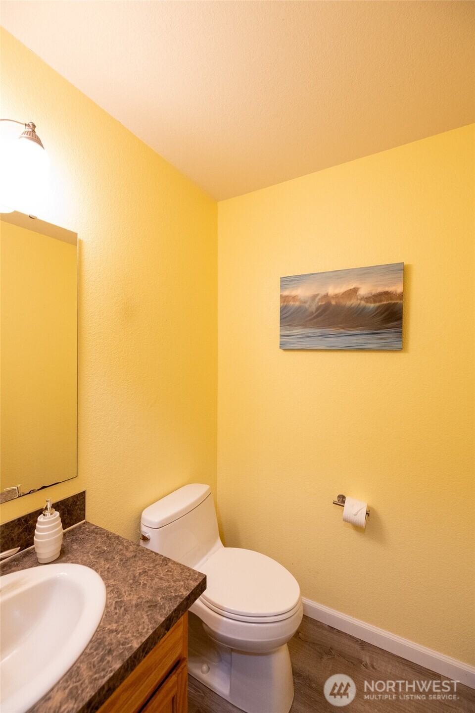 7332 183rd Avenue Southwest Rochester, WA 98579 - Photo 14 of 40 a bathroom with a granite countertop sink and a mirror